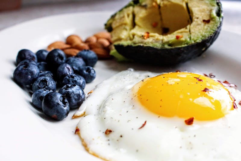 egg, avocado, blueberries, and nuts